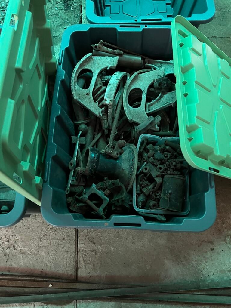 Hotchkiss and other car parts in tubs for shipping