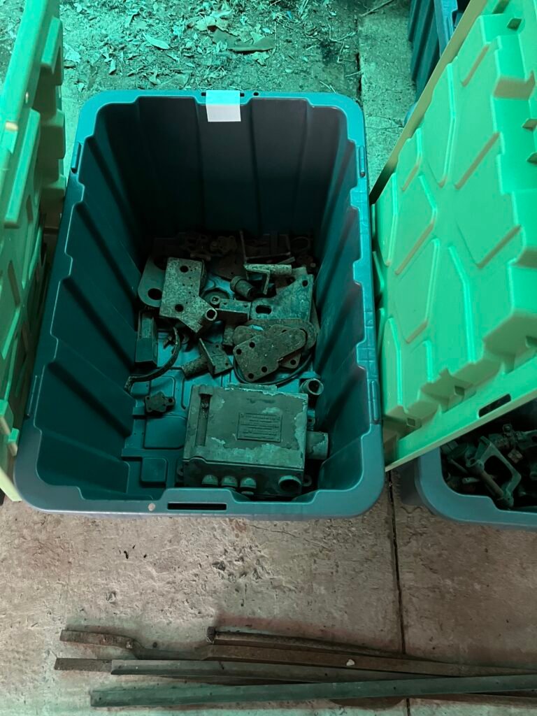 Hotchkiss and other car parts in tubs for shipping