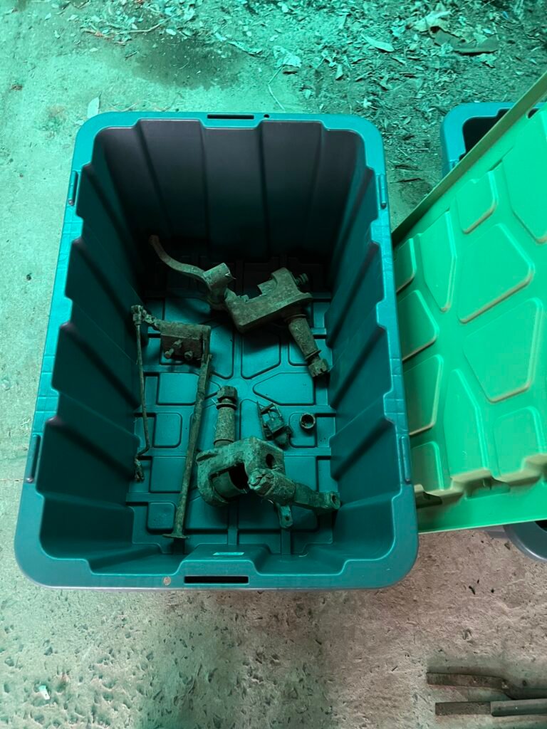 Hotchkiss and other car parts in tubs for shipping