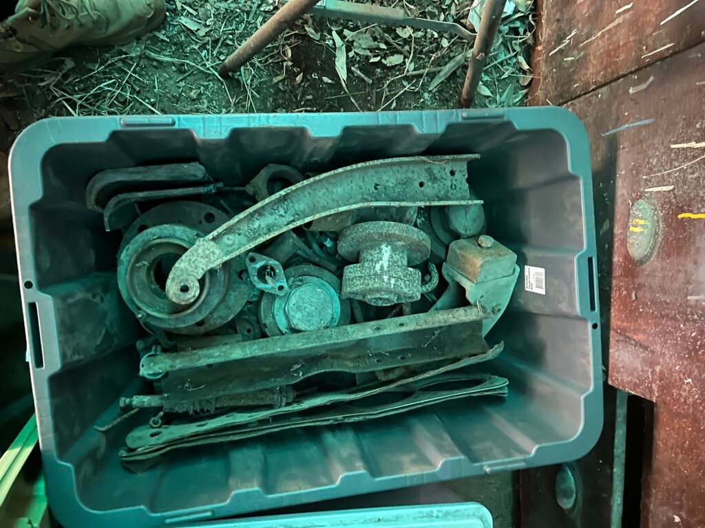 Hotchkiss and other car parts in tubs for shipping