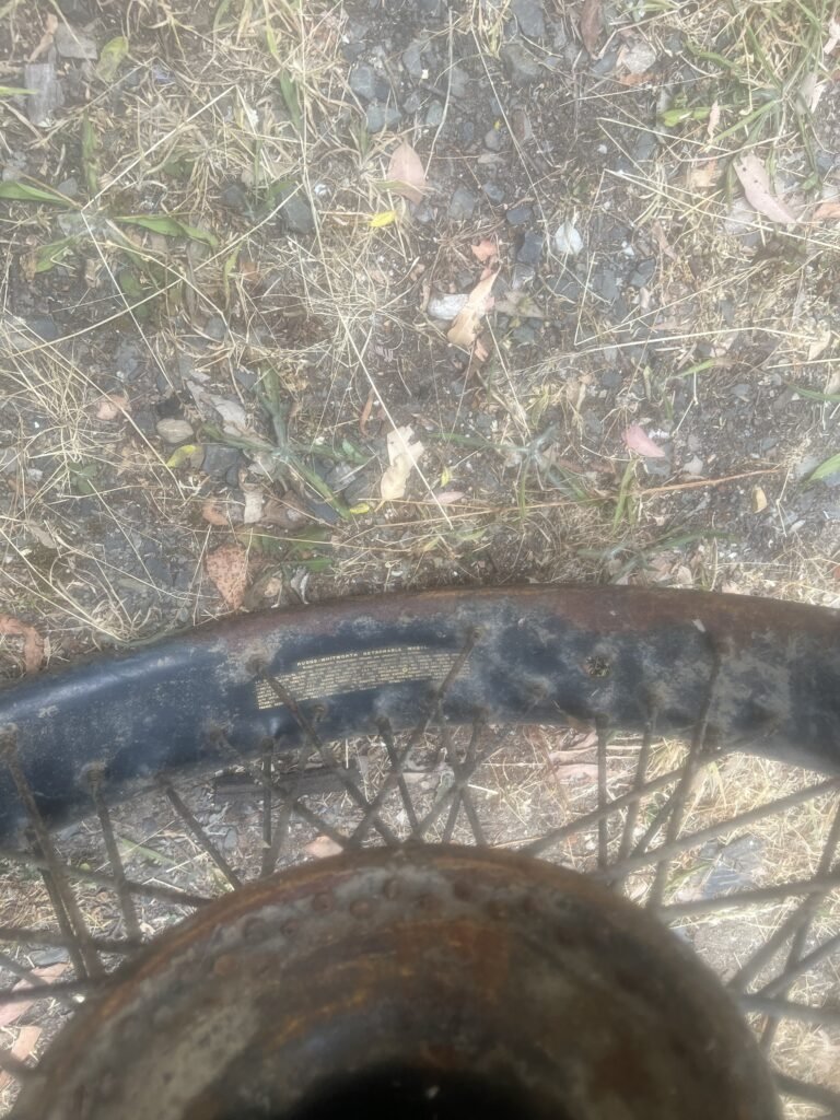 Photo of Patents Decal on rim of Rudge-Whitworth wire wheel.