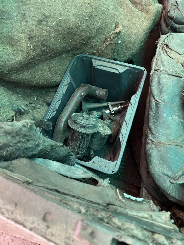 In front of car cabin small tub of specific parts