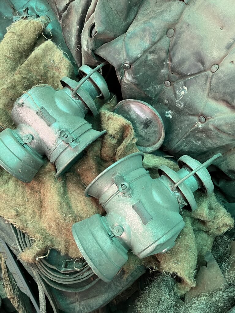 In front of car cabin side lamps wrapped in matting material