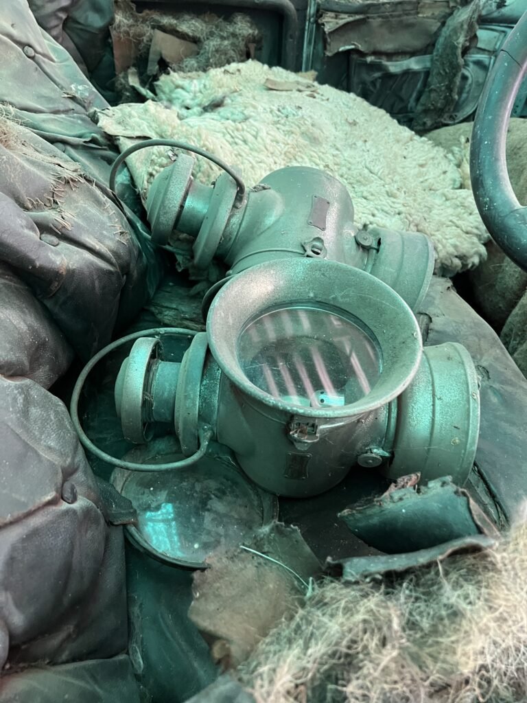 In front of car cabin side lamps wrapped in matting material