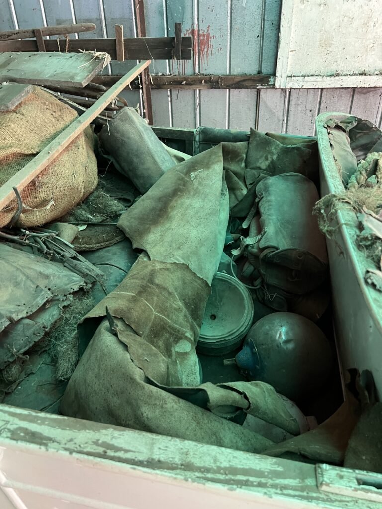 In rear seat section hessian bag contains loose seat stuffing and springs