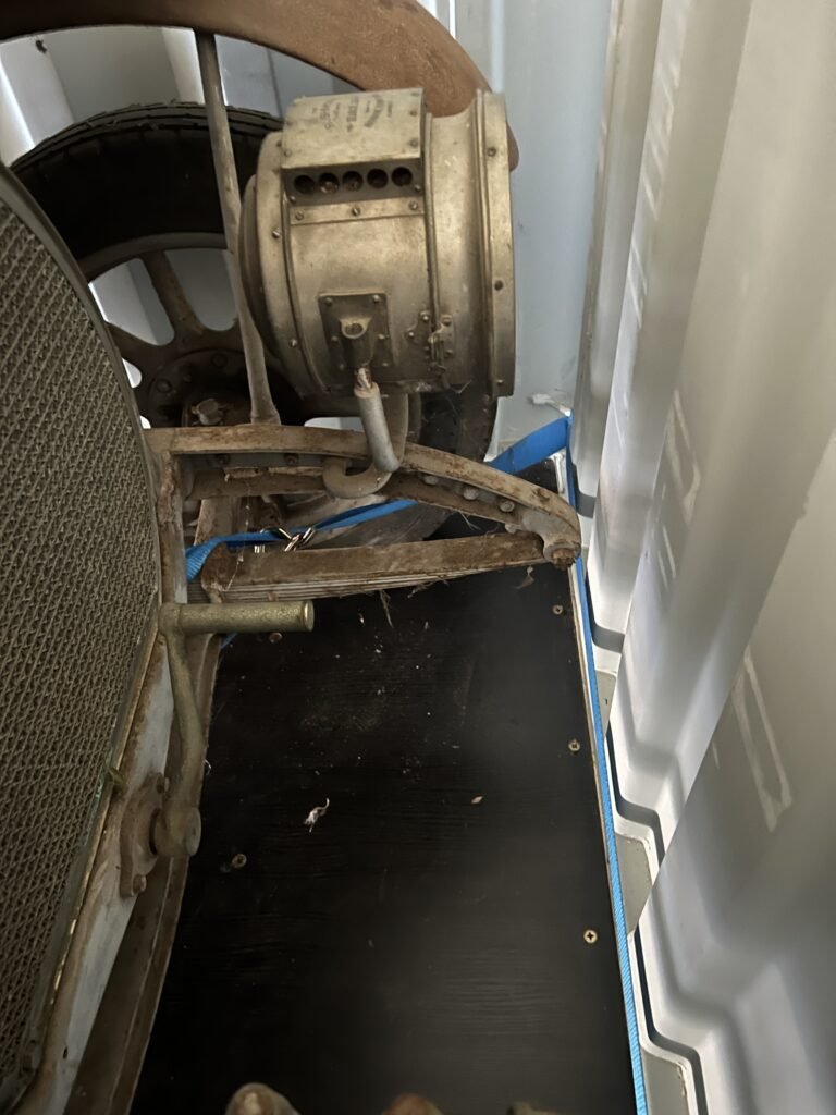 Container Front Axle Tie-Down Straps before Cardboard Packing